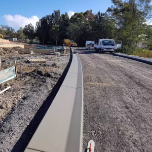 Installed concrete kerb at a construction site